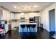 Modern kitchen with white cabinets, center island, and stainless steel appliances at 7860 Bristol Valley Dr, Cumming, GA 30028