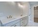 Double vanity with white quartz countertops and brushed gold fixtures at 5123 Goldsberry Ln, Mableton, GA 30126