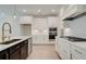 Modern kitchen with stainless steel appliances and white cabinets at 5123 Goldsberry Ln, Mableton, GA 30126