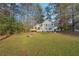 Spacious backyard with grassy lawn and deck at 5385 Telford Ct, Powder Springs, GA 30127