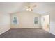 Main bedroom with high ceiling and carpet at 5385 Telford Ct, Powder Springs, GA 30127