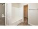 Bathroom with white bathtub and linen closet at 894 Churchill Ct, Stone Mountain, GA 30083