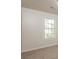 Bright bedroom with neutral walls, carpet, and window with blinds at 894 Churchill Ct, Stone Mountain, GA 30083