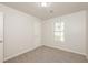 Spacious bedroom featuring neutral walls, carpet flooring, and a closet at 894 Churchill Ct, Stone Mountain, GA 30083