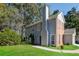 Two-story house with blue siding, brick accents, and a green lawn at 894 Churchill Ct, Stone Mountain, GA 30083