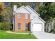 Charming two-story home with gray siding and brick accents at 894 Churchill Ct, Stone Mountain, GA 30083