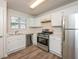 Kitchen with stainless steel appliances and white cabinets at 894 Churchill Ct, Stone Mountain, GA 30083