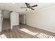 Spacious living area with hardwood floors and ceiling fan at 894 Churchill Ct, Stone Mountain, GA 30083