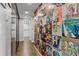 Hallway with hardwood floors and a unique album cover wall at 130 26Th St # 706, Atlanta, GA 30309