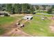 Aerial view of stables and paddocks at 2431 Perkerson Mill Rd, Austell, GA 30106