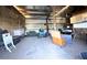 Interior of barn with seating and storage containers at 2431 Perkerson Mill Rd, Austell, GA 30106