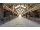 Bright barn aisle with numerous stalls at 2431 Perkerson Mill Rd, Austell, GA 30106