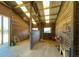 Spacious horse stall with wooden walls and ceiling, fan, and plenty of storage at 2431 Perkerson Mill Rd, Austell, GA 30106