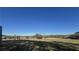 Open pasture with trees and a clear blue sky at 2431 Perkerson Mill Rd, Austell, GA 30106