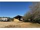 Covered storage area with sand and a camper at 2431 Perkerson Mill Rd, Austell, GA 30106
