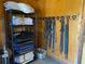 Organized tack room with shelves and hooks for storing horse riding equipment at 2431 Perkerson Mill Rd, Austell, GA 30106
