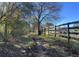 Dirt trail beside a wooden fence at 2431 Perkerson Mill Rd, Austell, GA 30106