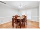 Cozy dining area with hardwood floors and light walls at 7260 Oswego Trl, Riverdale, GA 30296