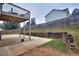 Large backyard with patio, deck, and retaining wall at 8432 Browns Mill Trce, Stonecrest, GA 30038