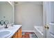 Bathroom with double vanity, bathtub, and mirror at 8432 Browns Mill Trce, Stonecrest, GA 30038