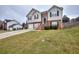 Two story home with attached two-car garage at 8432 Browns Mill Trce, Stonecrest, GA 30038