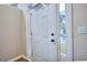 White front door with sidelights, offering natural light at 8432 Browns Mill Trce, Stonecrest, GA 30038