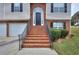 Brick stairs and walkway leading to the front door of the house at 8432 Browns Mill Trce, Stonecrest, GA 30038