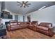 Large living room with a sectional sofa and hardwood floors at 8432 Browns Mill Trce, Stonecrest, GA 30038