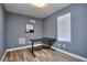 Bright home office features a corner desk and window at 8432 Browns Mill Trce, Stonecrest, GA 30038