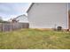 Side yard with grass and a wooden fence at 8432 Browns Mill Trce, Stonecrest, GA 30038