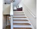 Staircase leading to the upper level of the home at 8432 Browns Mill Trce, Stonecrest, GA 30038