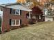 Brick house with a large yard and mature trees at 2852 Caraway Dr, Tucker, GA 30084