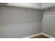 Simple closet with a single rod and grey walls at 3575 Oakvale Rd # 305, Decatur, GA 30034