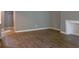 Living room with dark brown wood-look floors and a fireplace at 3575 Oakvale Rd # 305, Decatur, GA 30034