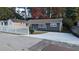 Charming gray house with a white picket fence and newly paved driveway at 26 Reeves St, Norcross, GA 30071