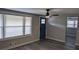 Living room with gray walls, wood-look floors, and a blue door at 26 Reeves St, Norcross, GA 30071