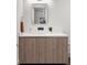 Stylish powder room with wood vanity and a mirror at 3107 Peachtree Ne Rd # 1502, Atlanta, GA 30305
