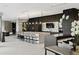 Modern community kitchen with sleek cabinetry and expansive island at 3107 Peachtree Ne Rd # 1502, Atlanta, GA 30305