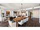 Modern dining room with large wood table and city views at 3107 Peachtree Ne Rd # 1502, Atlanta, GA 30305