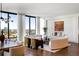 Elegant living room with a curved sofa, fireplace, and stunning city views at 3107 Peachtree Ne Rd # 1502, Atlanta, GA 30305
