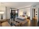Spacious main bedroom with hardwood floors and large windows at 3107 Peachtree Ne Rd # 1502, Atlanta, GA 30305