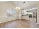 Dining area with hardwood floors and view into kitchen at 1960 Holland Park Dr, Buford, GA 30519