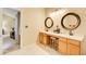Double vanity bathroom with light and bright decor at 3579 Oakshire Se Way, Atlanta, GA 30354