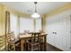 Breakfast nook with wood table and four chairs, built in cabinetry at 3579 Oakshire Se Way, Atlanta, GA 30354