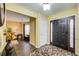 Bright entryway with dark hardwood floors and access to living room at 3579 Oakshire Se Way, Atlanta, GA 30354
