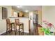 Kitchen features a breakfast bar, stainless steel appliances, and dark wood flooring at 3579 Oakshire Se Way, Atlanta, GA 30354