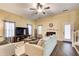 Spacious living room with hardwood floors, fireplace, and ceiling fan at 3579 Oakshire Se Way, Atlanta, GA 30354