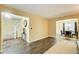 Open concept living and dining area with dark hardwood floors at 3579 Oakshire Se Way, Atlanta, GA 30354