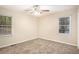 Well-lit bedroom with neutral walls and carpet flooring at 3661 Collins Dr, Douglasville, GA 30135