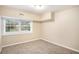 Spacious bedroom with window and neutral walls at 3661 Collins Dr, Douglasville, GA 30135